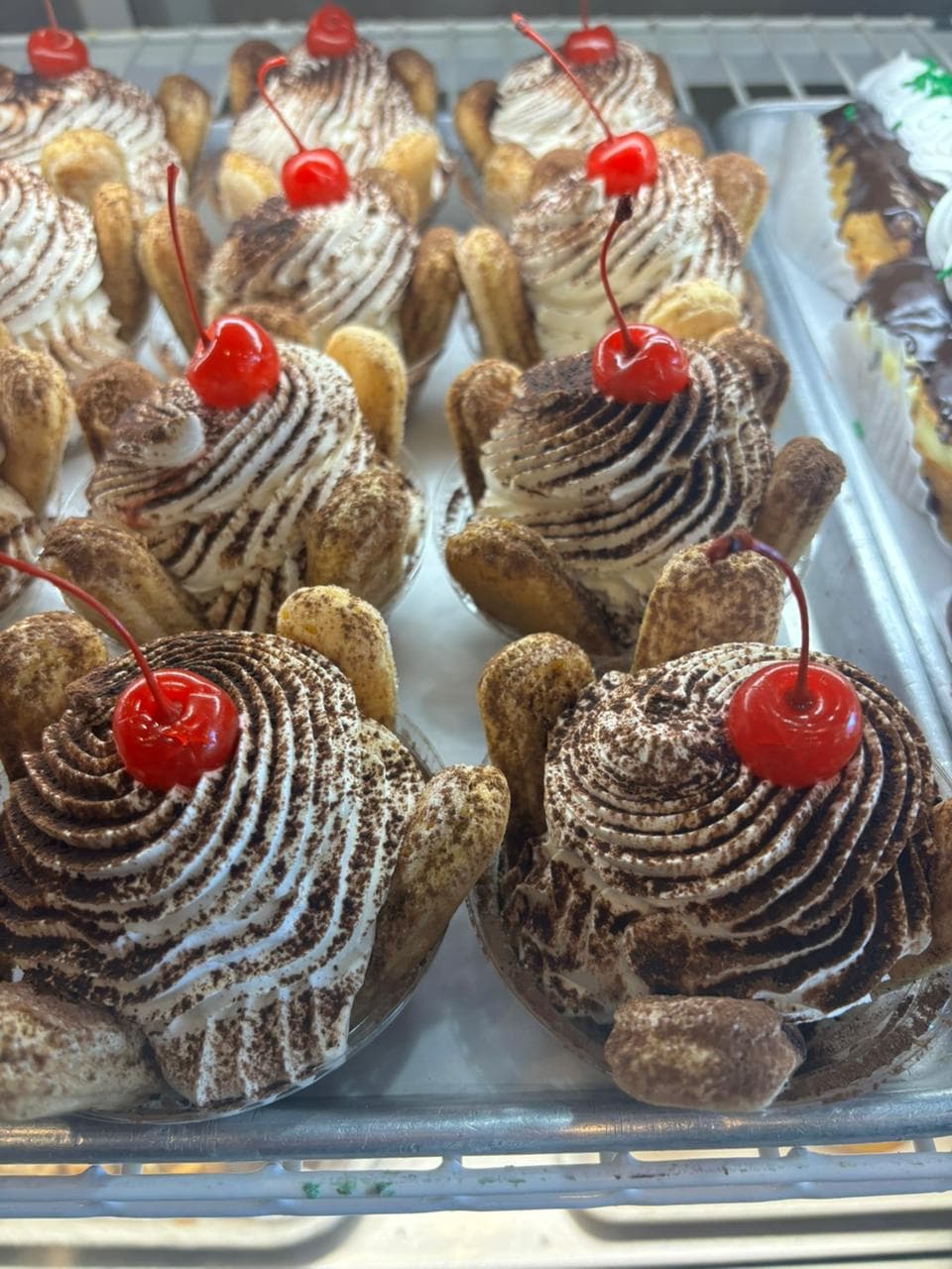 Zeppole cream puffs topped with cherries