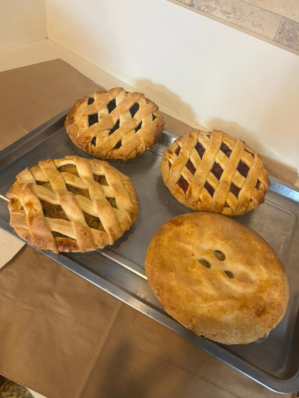 Lattice-topped fruit pies fresh from the oven
